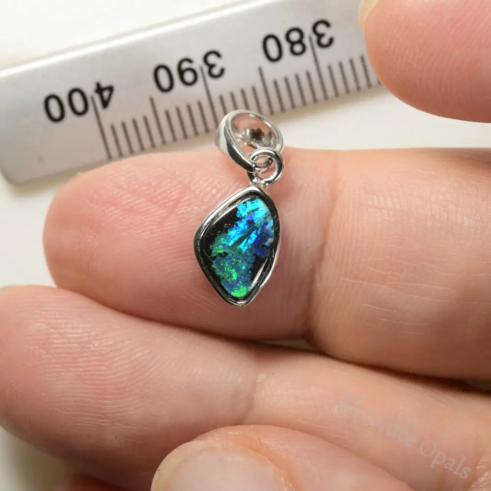 "Polished Australian Boulder Opal in an elegant silver pendant setting