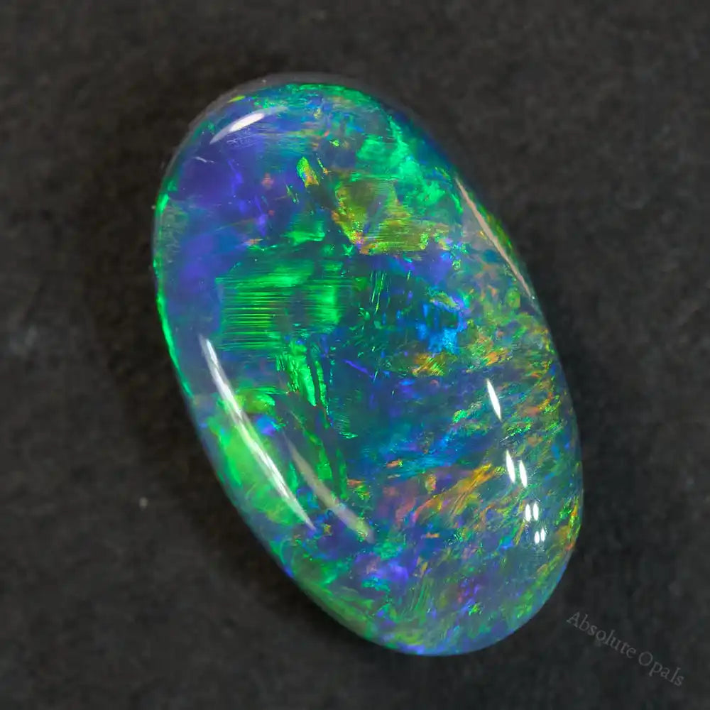 Genuine solid black opal from Lightning Ridge, expertly cut and polished. Vivid color play, perfect for collectors or fine jewelry.