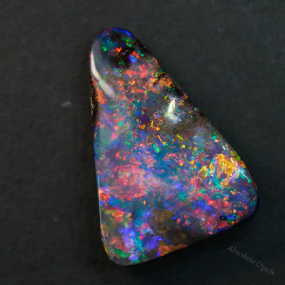 13.68 cts Boulder Opal Cut Stone, multi-colour with vibrant reds and blues, ideal for jewelry making.