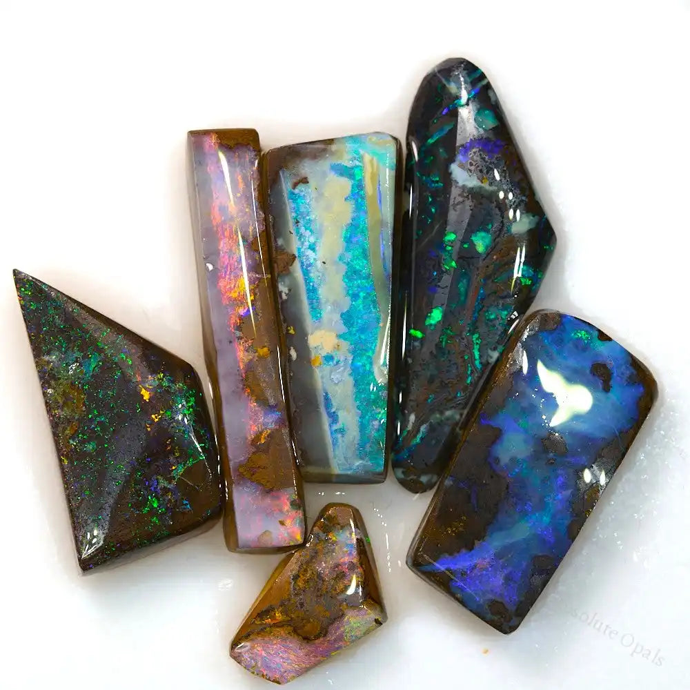 56.4 cts Boulder Opal rough stones showcasing vibrant red, green, and blue colors from Australia Queensland.