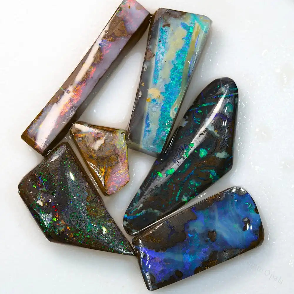 56.4 cts Boulder Opal rough stones showcasing vibrant red, green, and blue colors from Australia Queensland.