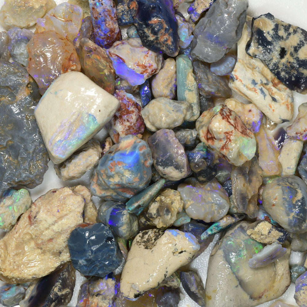 Rough opal parcel from Lightning Ridge featuring a mix of potch and color, including nobby opals with vibrant play-of-color. Ideal for lapidary, collectors, and opal enthusiasts