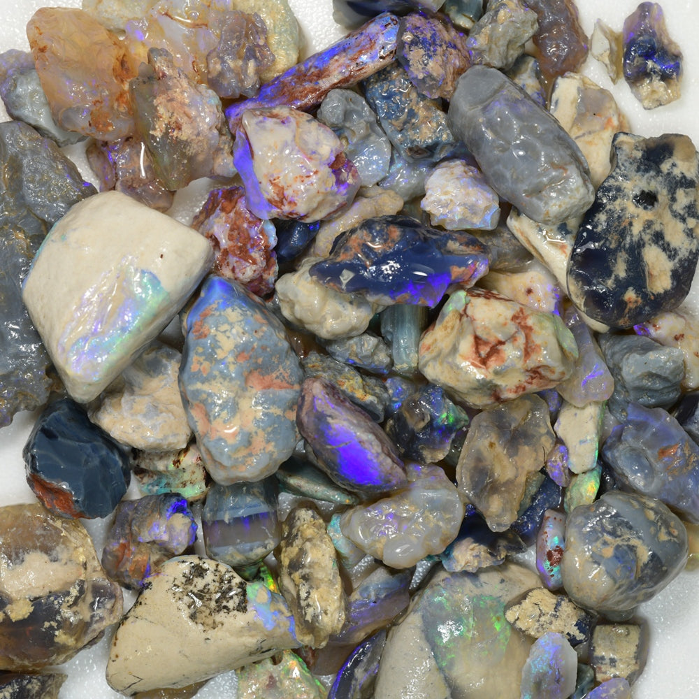 Rough opal parcel from Lightning Ridge featuring a mix of potch and color, including nobby opals with vibrant play-of-color. Ideal for lapidary, collectors, and opal enthusiasts