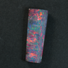 4.52 cts Boulder Opal cut stone featuring vibrant red and multi-colour hues, showcasing Australian craftsmanship.