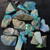 High-quality rough opal stones from Lightning Ridge, showcasing stunning blue and green hues, 124 cts total weight.