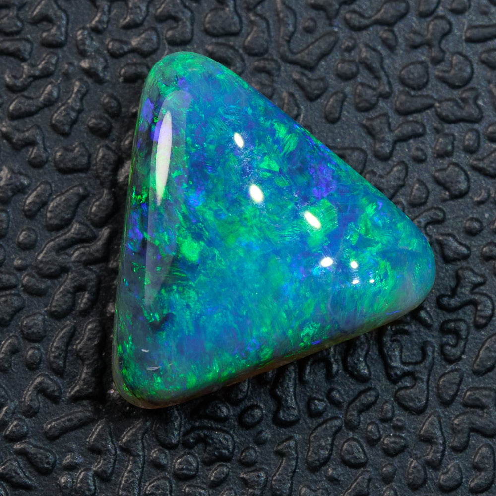 Black Opal from Lightning Ridge – solid stone with vivid green and blue play-of-color