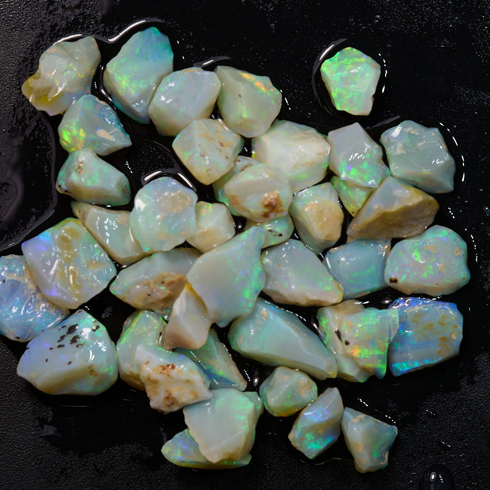 Rough opal chips in light green and multi-color hues, perfect for inlay and mosaic projects, weighing 50 cts.