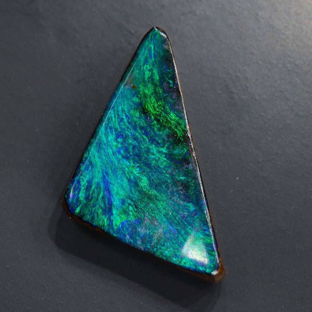 Polished boulder opal cut stone from Queensland, Australia