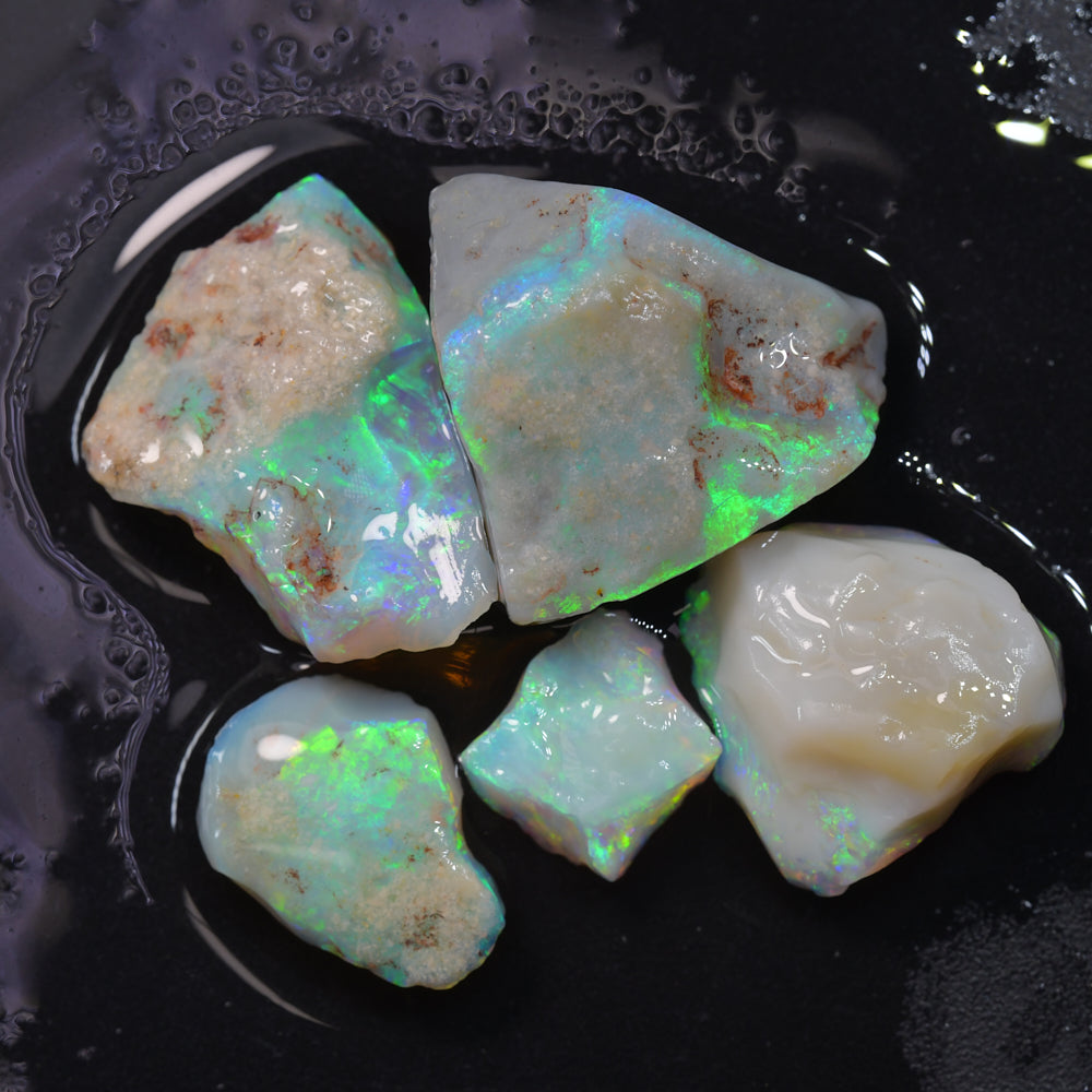 Rough opal parcel from Lightning Ridge, Australia, mine run selection containing natural opal rough with potch and colour, sold as a lot of five parcels