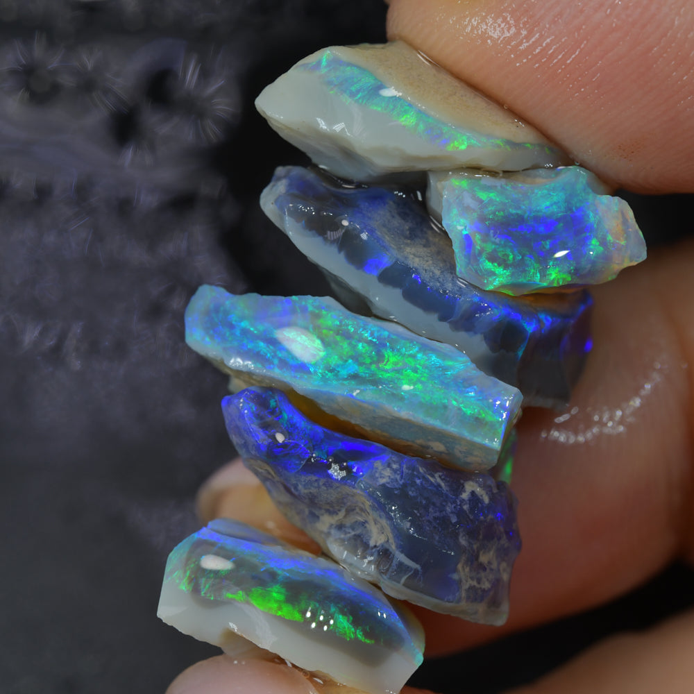 Rough black opal parcel from Lightning Ridge, Australia, containing natural black opal rough with colour potential and unique patterns