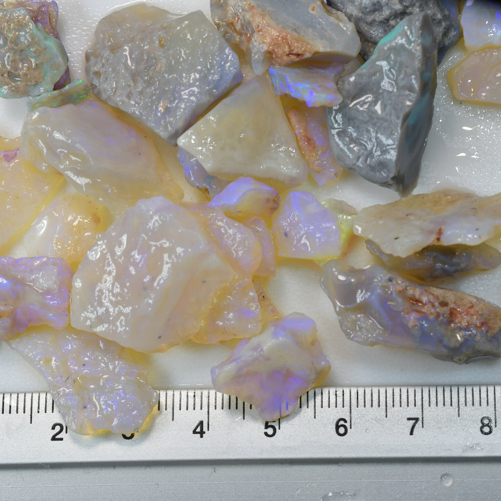 Rough opal parcel from Lightning Ridge, Australia, featuring natural potch and flashes of colour in untreated opal rough