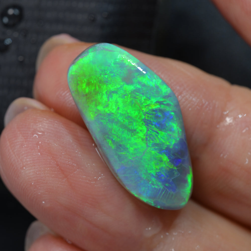 Lightning Ridge rough opal rub from Australia displaying vibrant green flashes of natural colour with excellent cutting potential