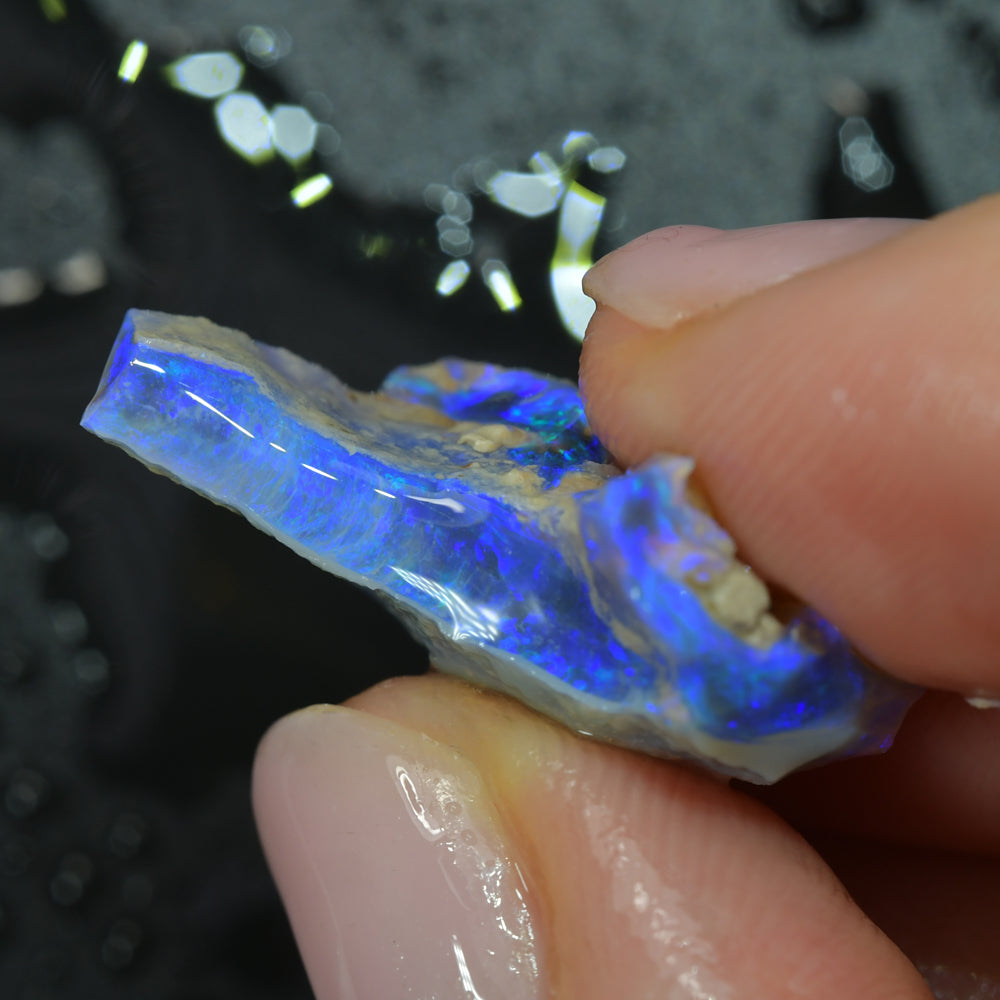 Lightning Ridge black opal carving with natural colour play