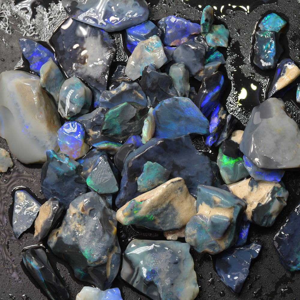 Natural Australian rough black opal parcel from Lightning Ridge featuring genuine black opal with potch and colour, ideal for cutting, polishing, lapidary work, jewelry making, and gemstone collecting