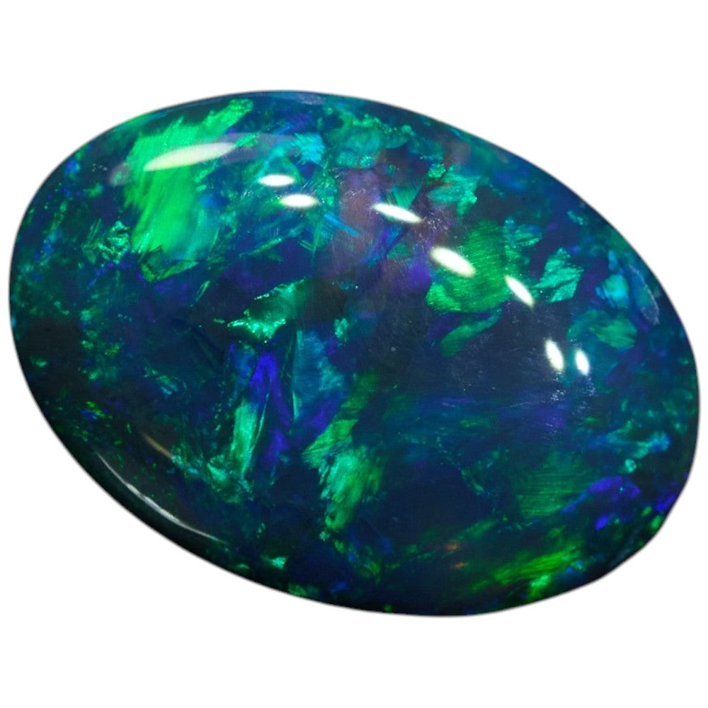 0.59 cts Black Opal from Lightning Ridge, displaying vibrant green and blue colors with an oval shape.