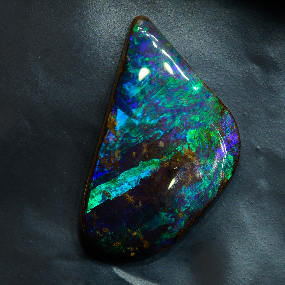 Boulder opal cut stone ready for jewelry making with natural ironstone backing and strong color flash