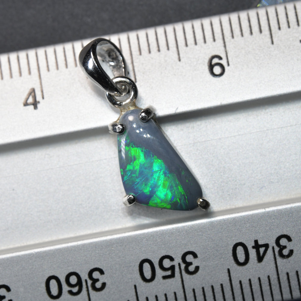 Lightning Ridge solid opal pendant set in silver, displaying natural Australian opal colour play