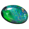 0.86 cts black opal from Lightning Ridge, oval cut with vibrant green colors and medium dome shape.